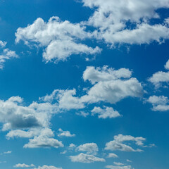 Naklejka na ściany i meble Beautiful blue sky with white clouds as a natural background