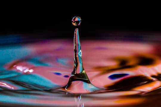 Water drop in glass. Drops, splashes, spray, abstract shapes out of the water