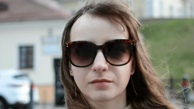 serious or sad girl portrait in sunglasses