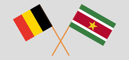Crossed flags of Belgium and Suriname. Official colors. Correct proportion