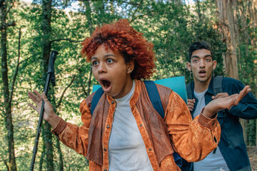 young people with backpack amazed and surprised