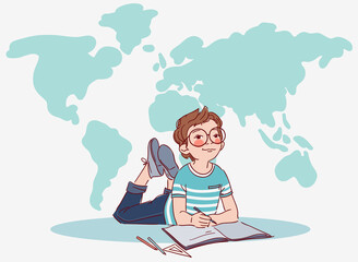 Little, cute boy writing in notebook. World map background