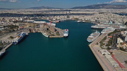 Aerial drone panoramic photo of famous and busy port of Piraeus where passenger ships travel to popular Aegean destinations, Attica, Greece