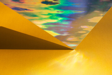 Composition with gold holographic paper. Retro futuristic style.