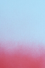 redspray paint on a soft blue colored paper background