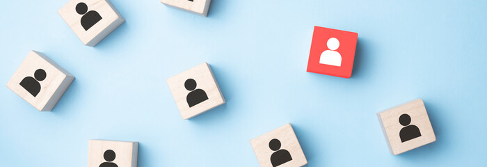 Building a strong team, Wooden blocks with people icon on pink background, Human resources and management concept.