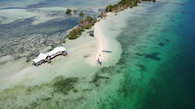 Perishing Island With Crystal Clear Ocean Water Drone Footage