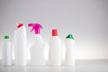 House and office cleaning theme. Set of white bottles with clining liquids on the white  background.