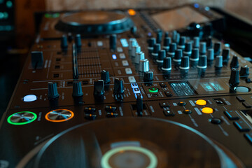 Player and mixing console closeup. DJ equipment