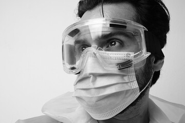 Close-up portrait of man wear masks and protective glasses.