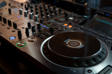 Fototapeta na wymiar Player and mixing console closeup. DJ equipment