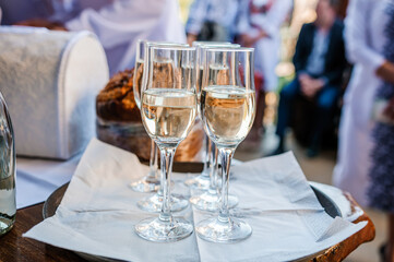 Glasses with white sparkling wine on a tray