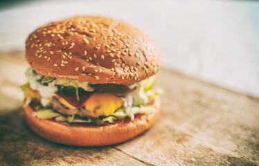 Rustic handmade hamburger on the table.