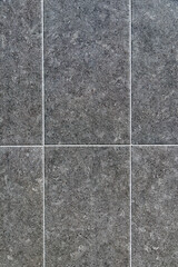 Dark gray wall background . Vertical photo.