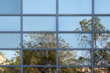 Glass building facade with reflections.