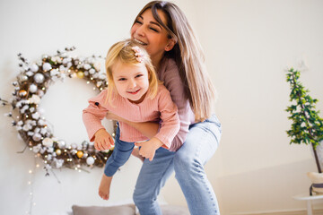 Mother and daughter indulge and laugh. 