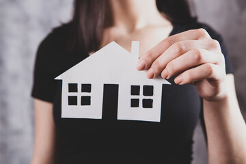 Family care and protection insurance concept. model of a small house