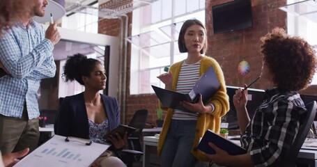 Diverse group of work colleagues having a meeting and discussion in the office - Powered by Adobe