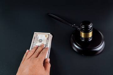 judge and money on the black background 