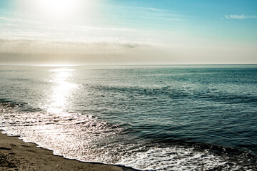 Sunrise over the sea. Glitter on the water.