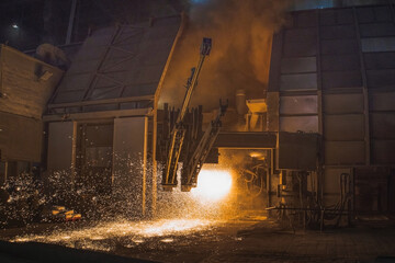 Big steel mill or iron furnace at work. Process of injecting oxygen to produce steel from iron...