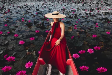 Fotobehang Fashion portrait young woman traveler on boat joy beautiful nature scenic landscape blooming red lotus flower, Tourist girl travel Thailand summer holiday vacation trip, Tourism destination place Asia © day2505