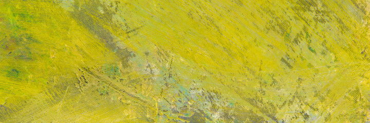 colorful creative motley background: smudged residues of oil paints on a wooden palette, short focus, selective blur