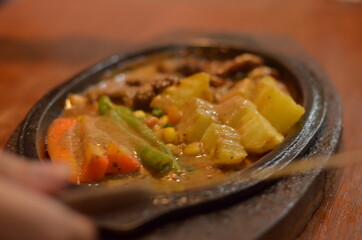 close up of Beef steak with delicious curry and vegetable seasoning