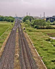 Fototapeta na wymiar Views of the empty railway line in the city of Cirebon, Indonesia.
