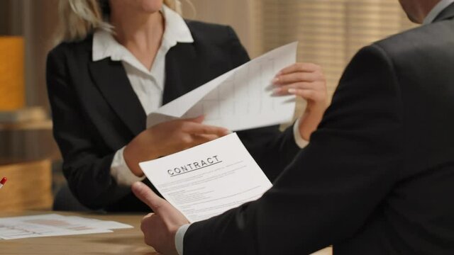 Partners discussing terms of contract, applicant for job. Man indignantly ripping contract to pieces. Termination of contract, rejecting paper, rip deal. Close up. Slow motion ready, 4K at 59.94fps.