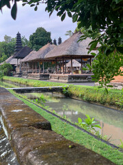 Fototapeta premium Balinese Pavilion Beside Water Canal