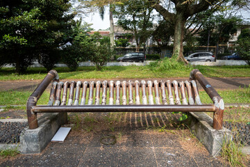 Permanent bench made of iron in Gasibu Bandung park near Gedung Sate.