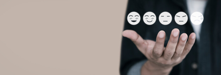 Man hand with white emotion icon on brown background, positive thinking, mental health assessment ,...