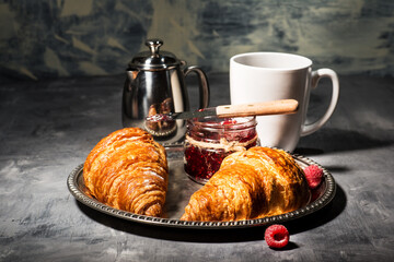croissant with raspberry jam and raspberries
