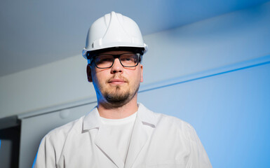 engineer working man portrait close up in construction helmet