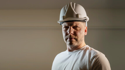 working man construction worker with dirty face looking at camera Close up portrait