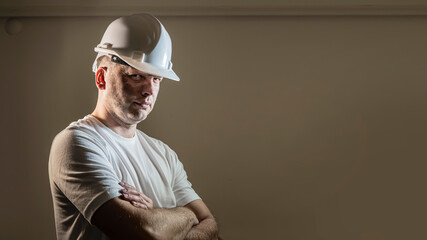 working man construction worker with dirty face looking at camera Close up portrait