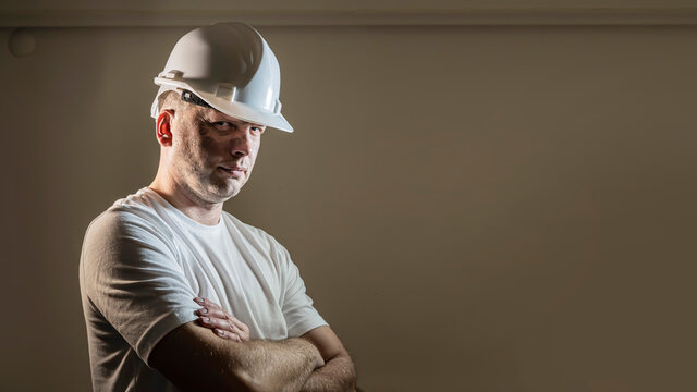 Working Man Construction Worker With Dirty Face Looking At Camera Close Up Portrait