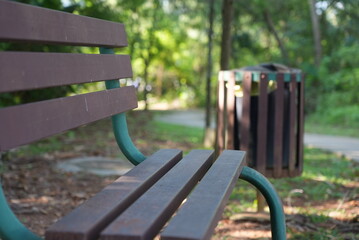 A calm old bench in the park. The park close due to covid 19 pandemic