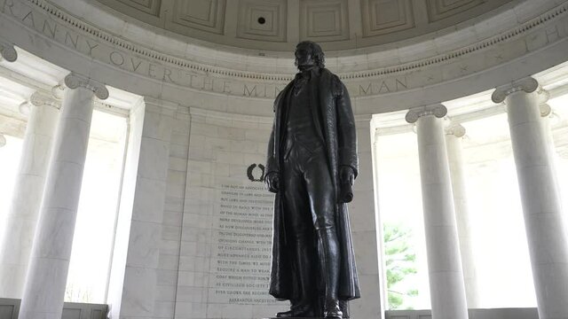 Turning shot of Thomas Jefferson inside the Jefferson Memorial on the National Mall in Washington, DC.