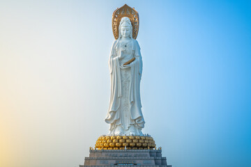 Beautiful front view of 108m high Guanyin of the South Sea statue of Nanshan Buddhism cultural park temple at sunrise in Sanya Hainan island China