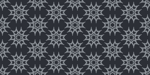 Stylish background patterns with gray geometric ornament on a black background, wallpaper. Seamless pattern, texture. Vector graphics