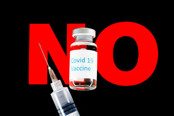 Covid 19 Vaccine Bottle with Needle and Syringe on a NO sign