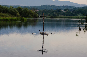 Floating crucifix on Posta Fibreno lake