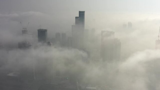 Skyscrapers rising above the clouds Aerial, Tel Aviv, Israel
Drone View over Buildings on fogy day, September,20,2021, Tel aviv, Israel
