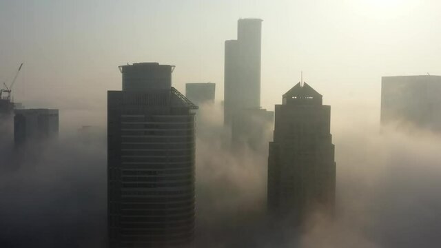Skyscrapers rising above the clouds Aerial, Tel Aviv, Israel
Drone View over Buildings on fogy day, September,20,2021, Tel aviv, Israel
