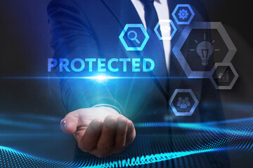 Business, Technology, Internet and network concept. Young businessman working on a virtual screen of the future and sees the inscription: Protected