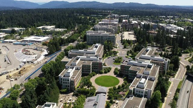 Cinematic birdseye drone footage, development of the new campus at the Microsoft Corporate Headquarters, Microsoft Commons, Microsoft Studio in Overlake and Redmond, Washington, near Bellevue, Seattle