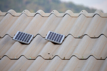 A small, close-up solar panel placed on the roof. Affordable solar power