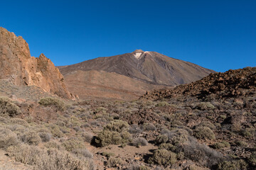  View of Roques de García unique rock formation with famous Pico del Teide mountain volcano summit in the background on a sunrise, Teide National Park, Tenerife, Canary Islands, Spain